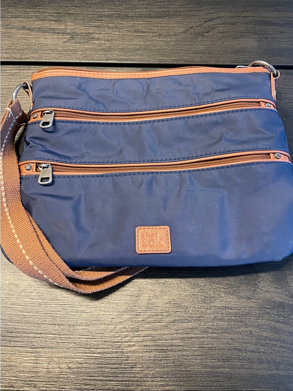 The Sak Navy Crossbody with Brown Trim and Woven Strap